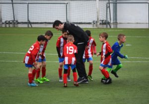 Summer Jobs for Teachers - Man is coaching boys' soccer team