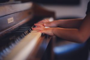 Sumer Jobs for Teachers - Child playing piano
