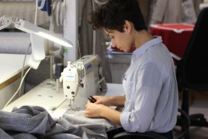Summer Jobs for Teachers - woman using sewing machine