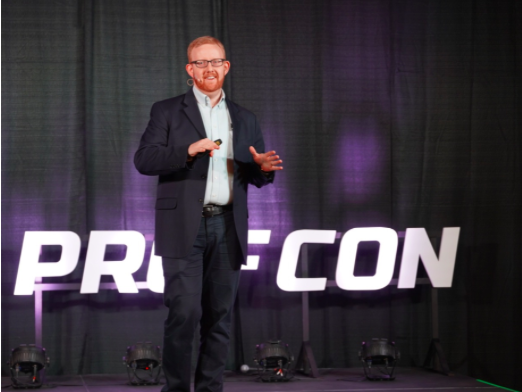 Scott Cowley on stage at ProfCon 2019