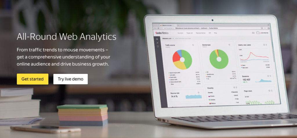 An image of the Yandex landing page which shows a laptop open up to Yandex analytics.