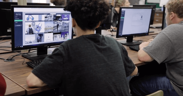 High school student using Stukent's Mimic Social simulation on a desktop computer in a classroom