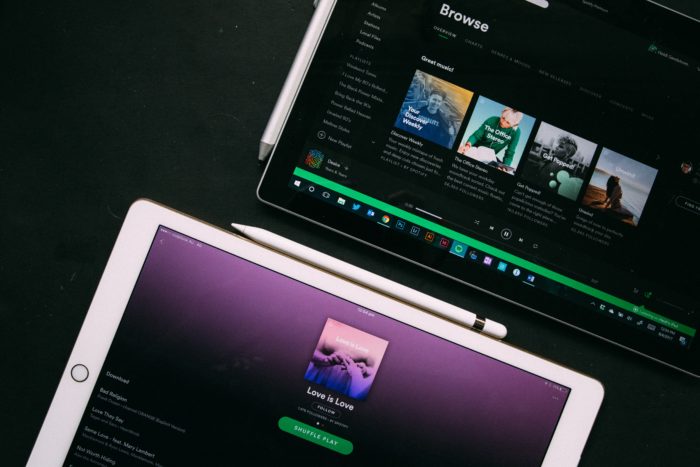 Two iPads with Spotify open